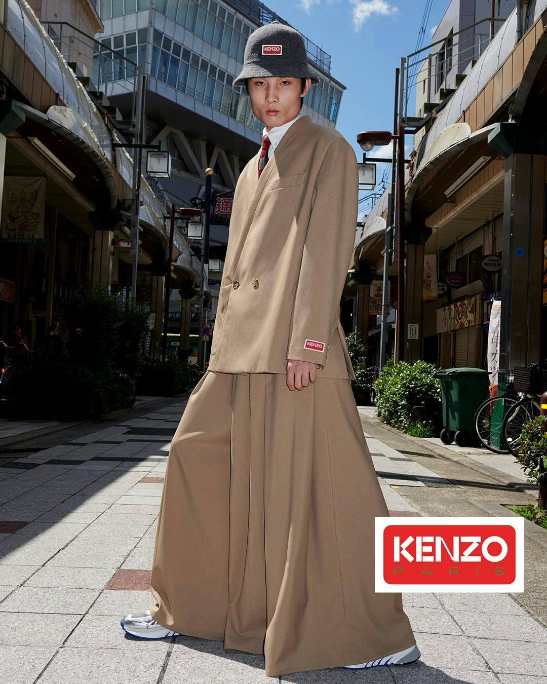 coat fashion overcoat adult female person woman long sleeve walkway wheel