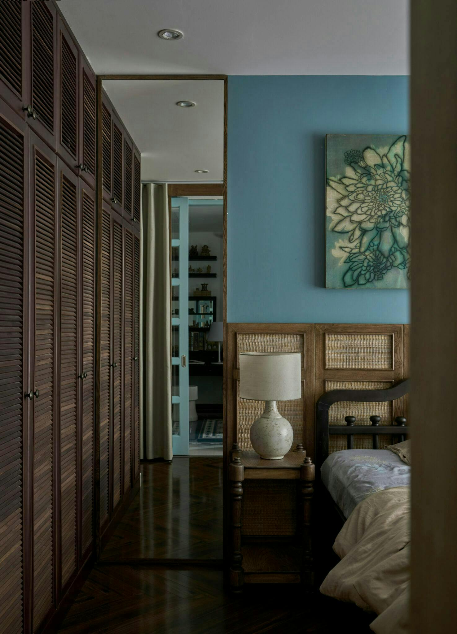 indoors interior design floor flooring wood hardwood lamp bed furniture home decor